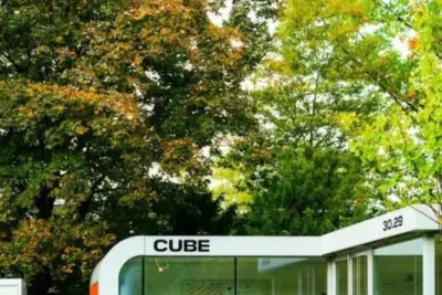 TK Karlsruhe Kontakt: Telefonnummer, Adresse, Öffnungszeiten und Parkmöglichkeiten 10 "Modulares Bürogebäude, genannt CUBE, in einem Park"